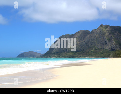 hawaii empty beach scene with mountains and sky Stock Photo