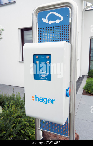 Station for charging electric car at modern  highly energy efficient family house in Germany Stock Photo