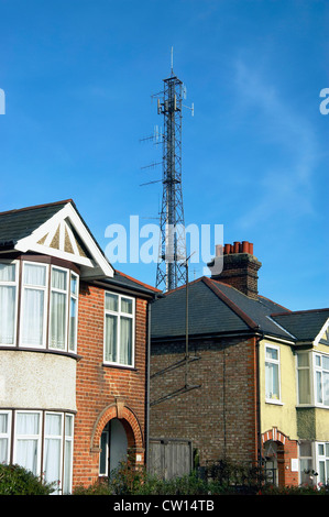 Mobile phone mast near dwellings. England, UK. Stock Photo