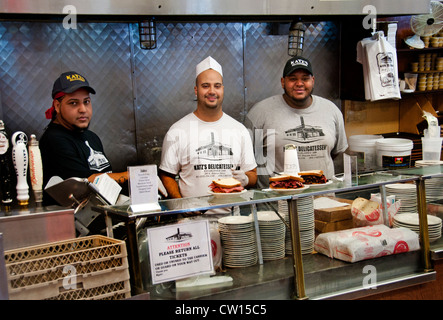 Diners fill tables and wait at the counter inside the historic Katz's Delicatessen restaurant in the Lower East Side of Manhattan, New York City. Stock Photo