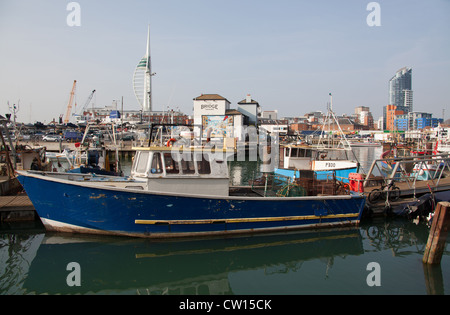 City of Portsmouth, England. Fishing boats berthed at Camber Docks with the Spinnaker Tower in the background. Stock Photo
