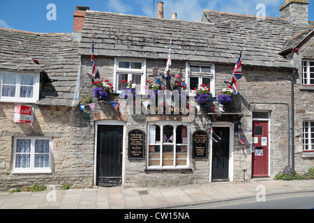 The patriotic Fox Inn public house in Corfe Castle, Dorset, UK. Stock Photo