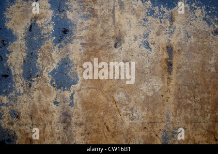 Decaying wall in blue, beige and brown colours. Grungy background for  graphic layout. Stock Photo