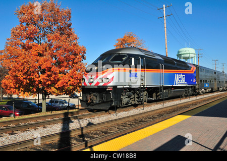 USA Illinois Metra commuter train arriving at the Bartlett suburban station from Chicago. Bartlett, Illinois, USA. Stock Photo