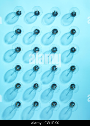 Group of turned off incandescent tungsten light bulbs on blue background Stock Photo
