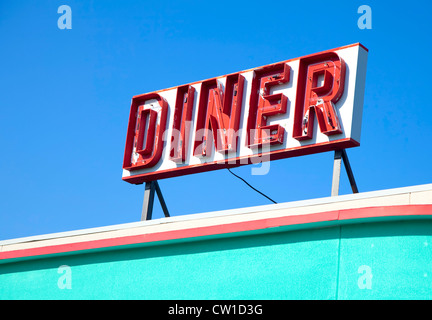An old retro diner sign on top of a building. Stock Photo