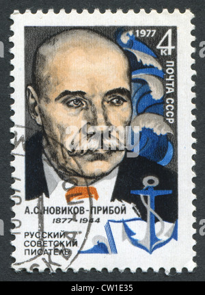 USSR - CIRCA 1977: Postage stamps printed in the USSR, shows Russian Soviet writer Novikov-Priboy, circa 1977. Stock Photo