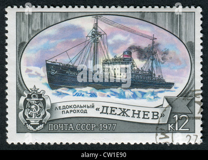 USSR - CIRCA 1977: Postage stamps printed in the USSR, shows the Russian icebreaker 'Dezhnev', circa 1977 Stock Photo