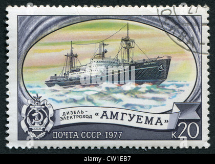 USSR - CIRCA 1977: Postage stamps printed in the USSR, shows the Russian diesel-electric 'Amguema', circa 1977 Stock Photo