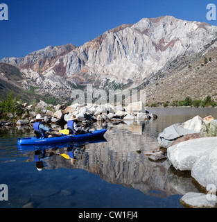 Kayakers explore Convict Lake in the Eastern Sierra near Mammoth Lakes, California Stock Photo