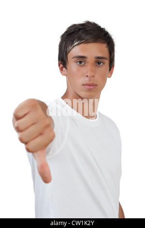 young swarthy man with brown eyes gives the thumbs down gesture on white background Stock Photo