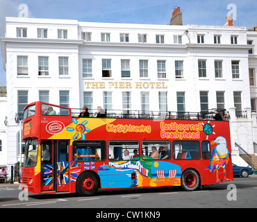 Eastbourne. Sightseeing bus in front of The Pier Hotel, in Eastbourne, East Sussex, England, UK. Stock Photo