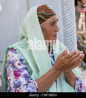 female pilgrim, Shrine of Baha al-Din Naqshband, Bukhara, Uzbekistan Stock Photo