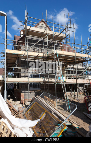 New build house on new estate under construction with scaffolding, Abergavenny, Wales, UK Stock Photo