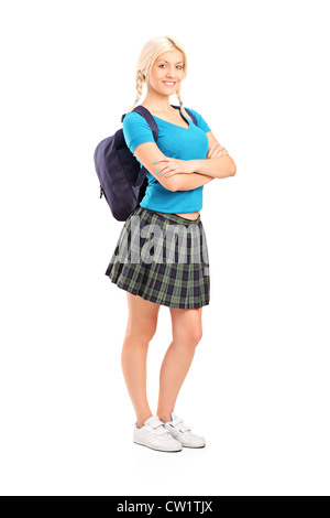 Full length portrait of a female student standing with crossed hands, isolated on white background Stock Photo