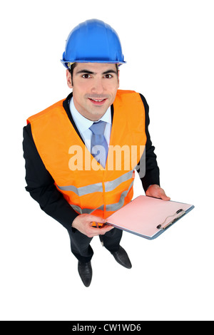 businessman taking notes on a construction site Stock Photo