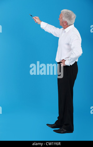 Man pointing to an invisible object Stock Photo