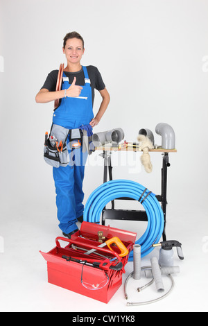 Tradeswoman giving the thumb's up Stock Photo