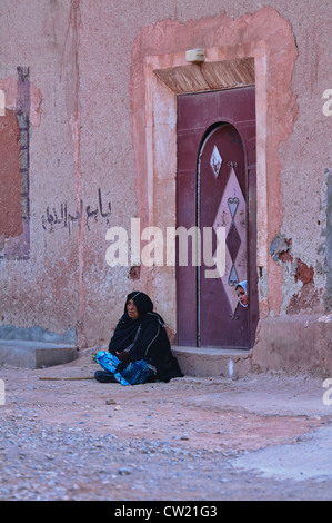 old beggar woman in the Valley of Roses, Morocco Stock Photo