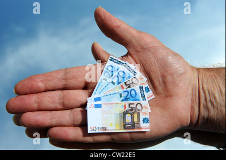 Euro money cash notes in hand euros Stock Photo