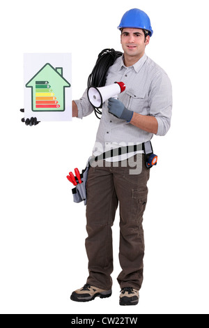Electrician with an energy rating sign Stock Photo