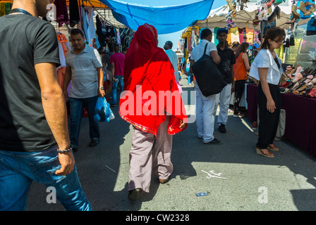 MONTREUIL (Paris), France, Large Crowd of People, Woman in Traditional Dress, Walking away, Shopping in Outdoor Flea Market, at 'Porte de Montreuil' Suburbs, immigrants Europe, suburban street, multicultural street, integrated Stock Photo