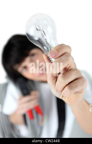 craftswoman holding a bulb Stock Photo