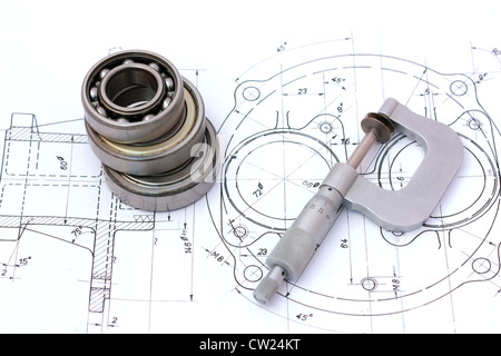 Three ball bearings over and over with micrometer on technical drawing Stock Photo