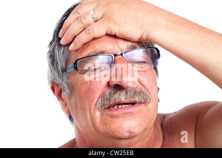 Close up of senior man with headache, isolated on white background. Stock Photo