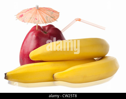 Bunch of fresh bananas and red apple with coctail umbrella isolated on white background Stock Photo