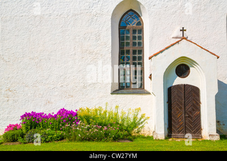 White painted chirch wall with window and door Stock Photo
