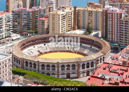 Malaga Andalusia Andalucia Spain Bull ring Bullring Plaza de Toros de la Malagueta with apartment blocks and the sea. Stock Photo