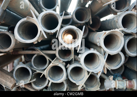 Side view of a pile of metal pipes Stock Photo