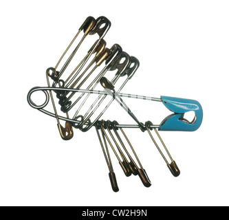 Macro image of many safety pins for clothes making on white background Stock Photo