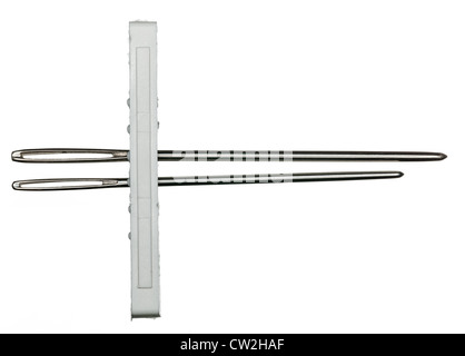 Two embroidery needles in holder isolated against white Stock Photo