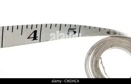 Measuring tape with inches made of cloth and isolated against white background Stock Photo