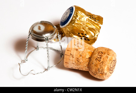 Champagne cork and cage with bottle neck foil on white back ground Stock Photo