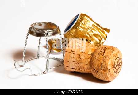 Champagne cork and cage with bottle neck foil on white back ground Stock Photo