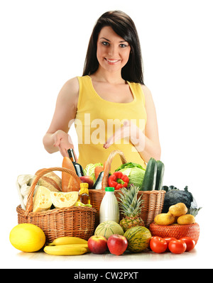 Young woman with grocery in wicker baskets isolated on white Stock Photo
