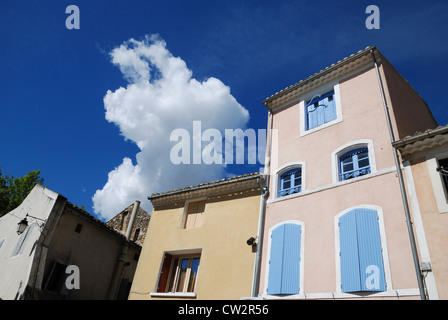 Blue shuttered windows in Sainte Cécile les Vignes, Vaucluse, Provence, France. Stock Photo