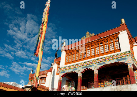 The colorfully decorated front of Korzok Monastery with a prayer flagpole in the high altitude village of Korzok, Ladakh, India Stock Photo