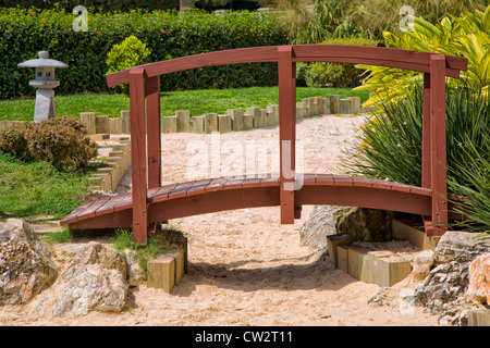 A Japanese garden bridge over a dry river of sand. Stock Photo