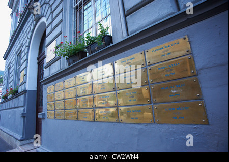 Memorial gold tablet (plates) with victims' names of the 1992-96 Bosnian war on a Sarajevo building Bosnia and Herzegovina Stock Photo