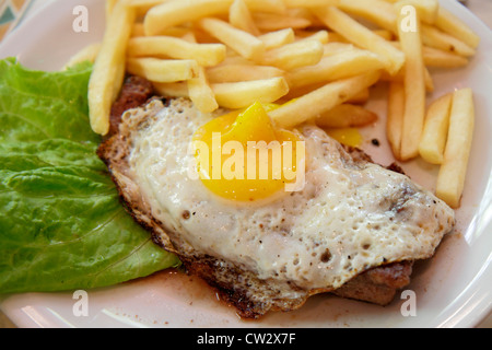 Mendoza Argentina,Paseo Sarmiento,pedestrian mall,dining,plate,dish,food,streak,fried egg,French fries,yolk,Latin American,South America,Argen12012803 Stock Photo