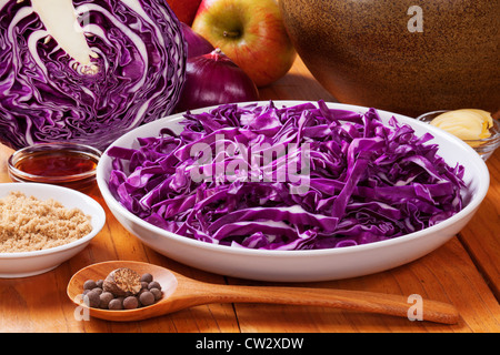Ingredients for spiced red cabbage with apple, delicious with Christmas meats. Stock Photo