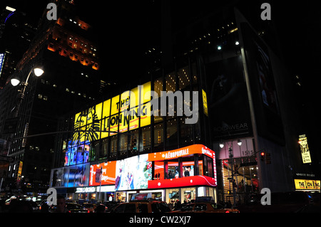 Night view, towards red neon Aeropostale clothes store, queuing traffic, 7th Avenue at West 45th Street, Times Square, New York Stock Photo
