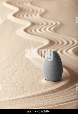zen garden symplicity and harmony form a background for meditation and relaxation, for balance and health stone and sand pattern Stock Photo