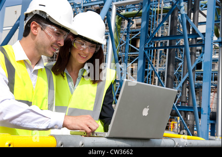 technicians working in industrial chemical plant, norfolk, england Stock Photo