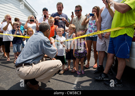 President Barack Obama talks with people outside Kozy Corners restaurant July 15, 2012 in Oak Harbor, Ohio. Stock Photo
