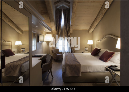 Bedroom in a classic traditional hotel in Italy Stock Photo